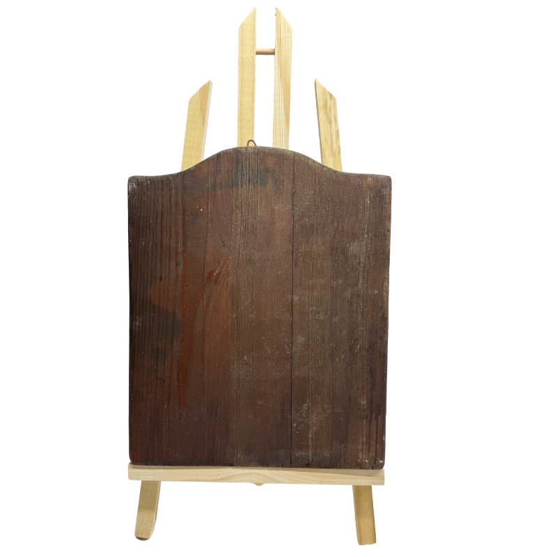 Back of an antique Orthodox icon with a hand-carved wooden panel and natural aging.