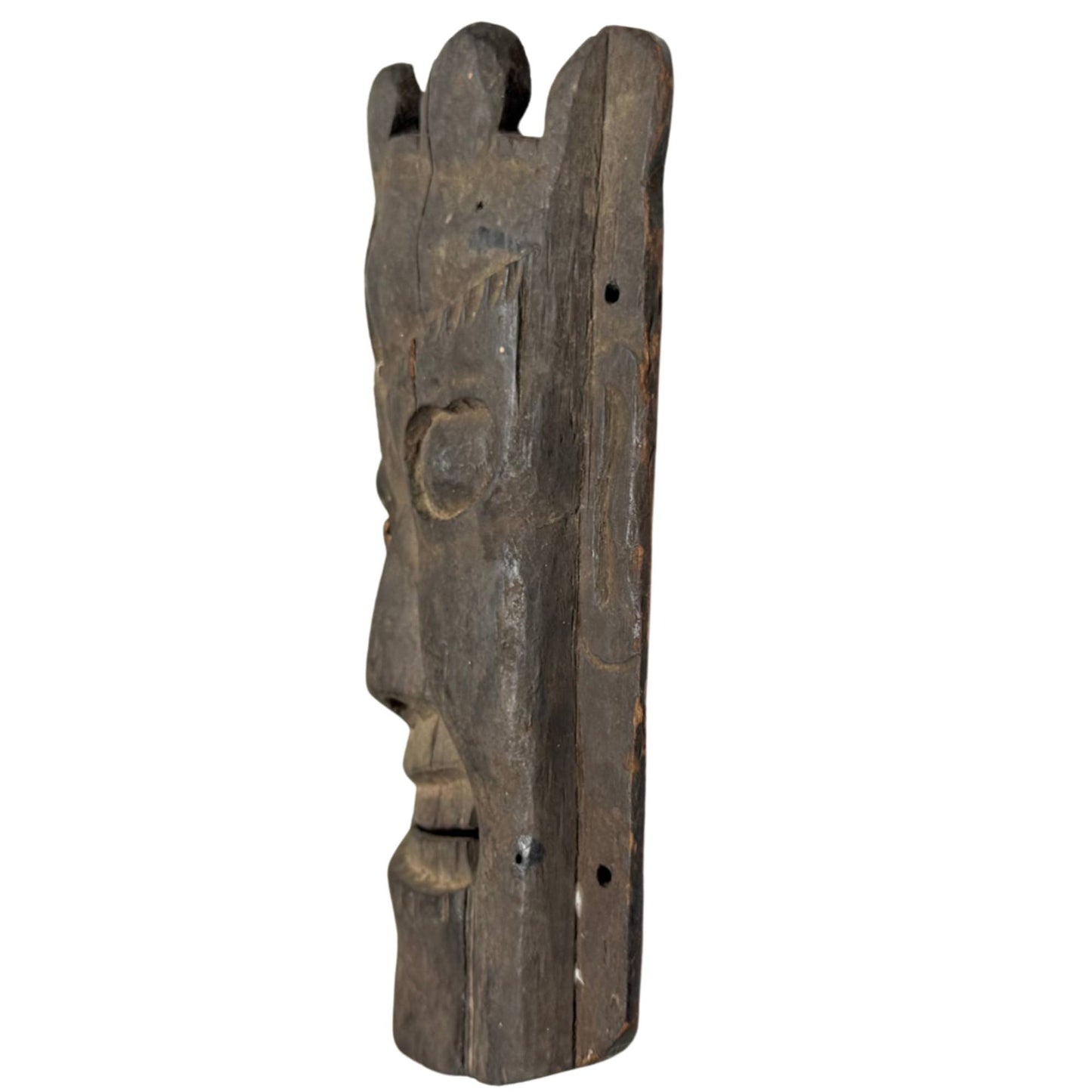Antique Nepalese mask as a powerful interior object, wooden Himalayan art with dark patina