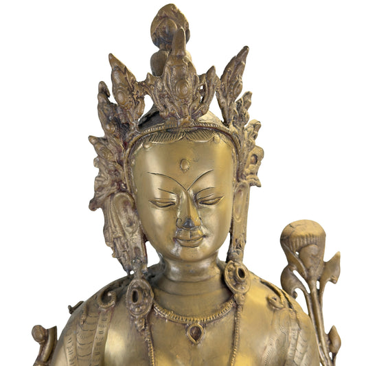Détail du visage d'une Tara verte antique du Népal, probablement du XVIIIe siècle, avec couronne et restes de dorure à la flamme.