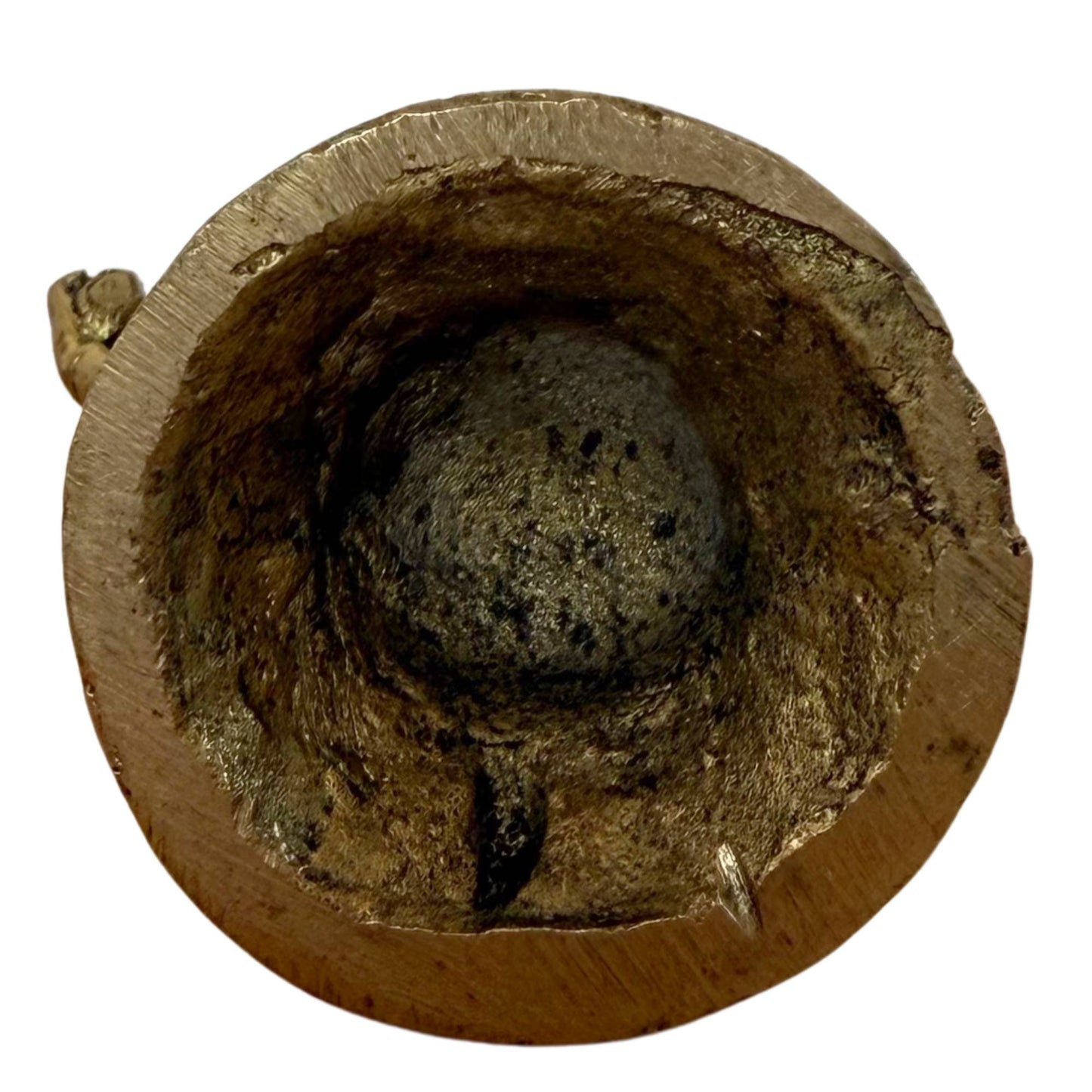 Forensic detail of the underside with the mineralized casting core in the base.