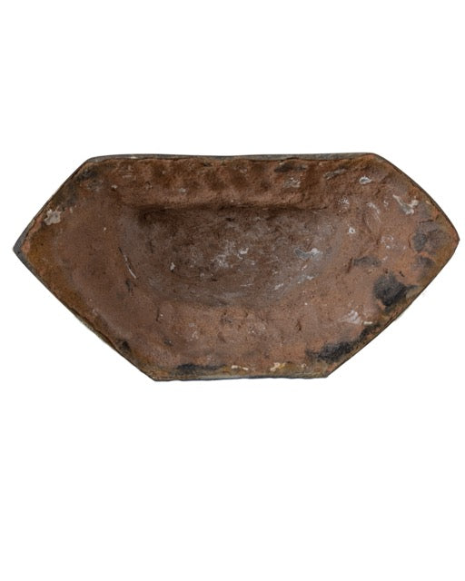 Inside of the bronze statue with visible original mineral casting core.