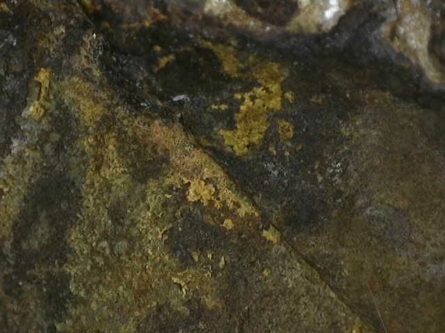 Fire gilding under the arm of this bronze Buddha, not visibly normal.