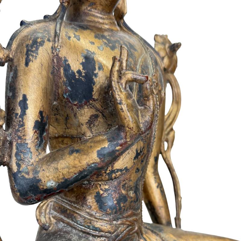 Characteristic mudra hand gestures on a Sino-Tibetan Buddha statue