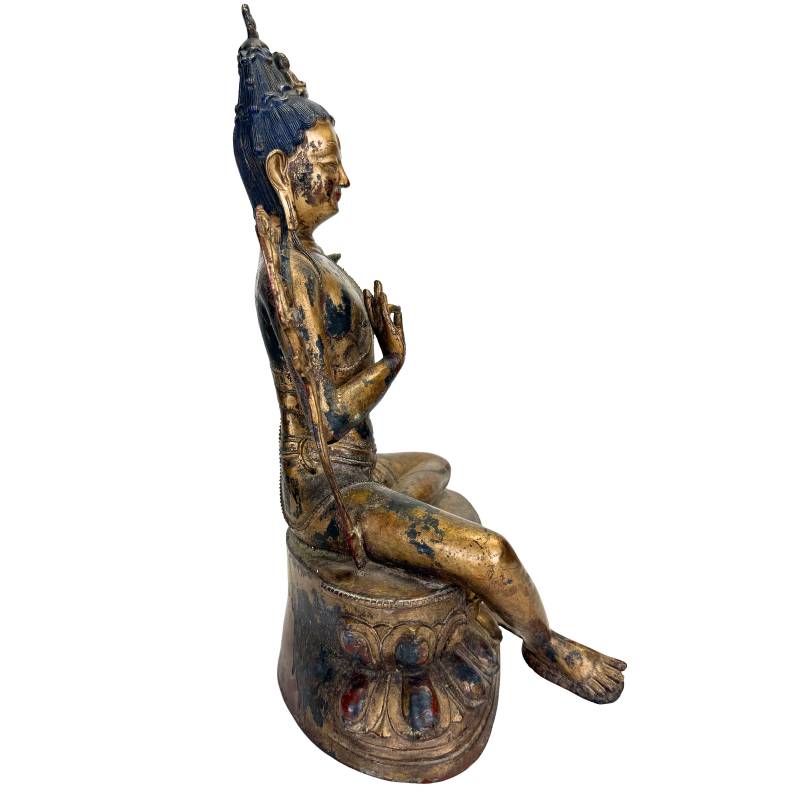 Natural patina and warm gilding on a Tibetan Bodhisattva