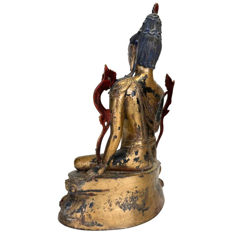 Natural patina and warm gilding on a Tibetan Bodhisattva