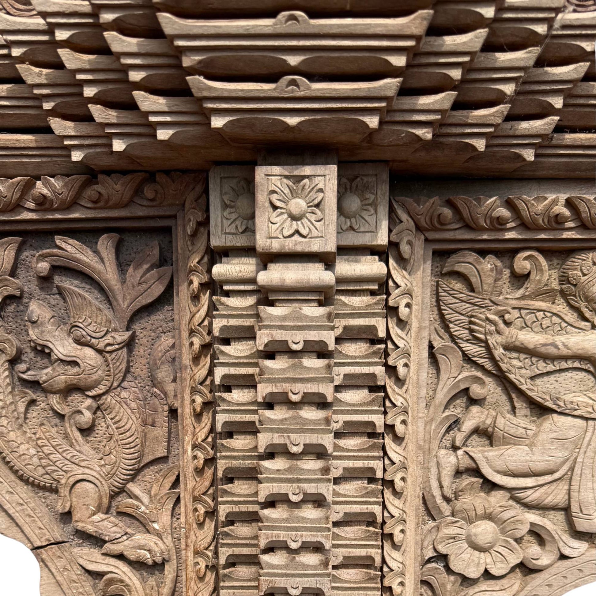 Detail Makara carving side panel teak architectural frame