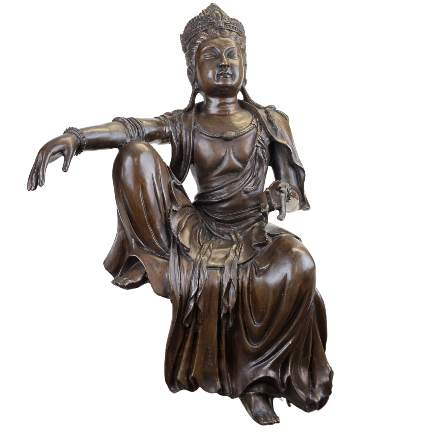 A historical bronze statue of Guanyin displayed in a museum setting.