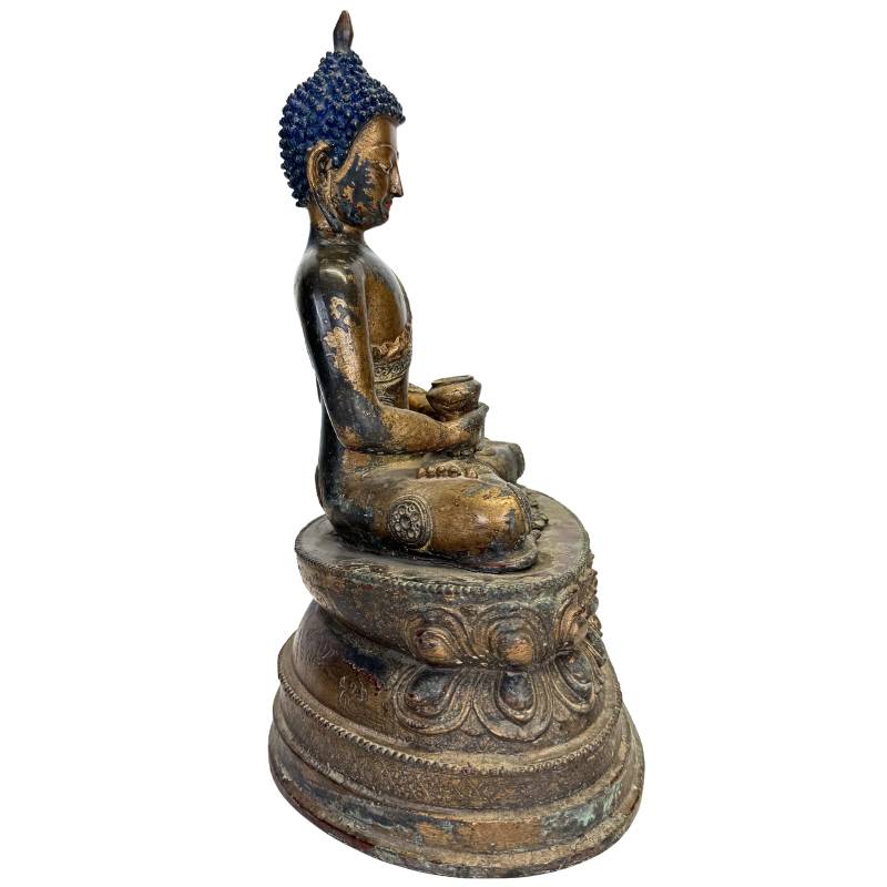Buddha statue with medicine bowl and traditional blue hair