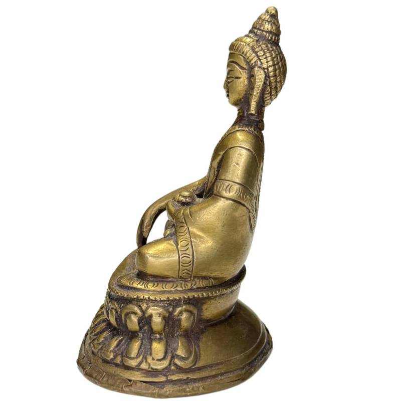 Close-up of the serene face of the Shakyamuni Buddha.
