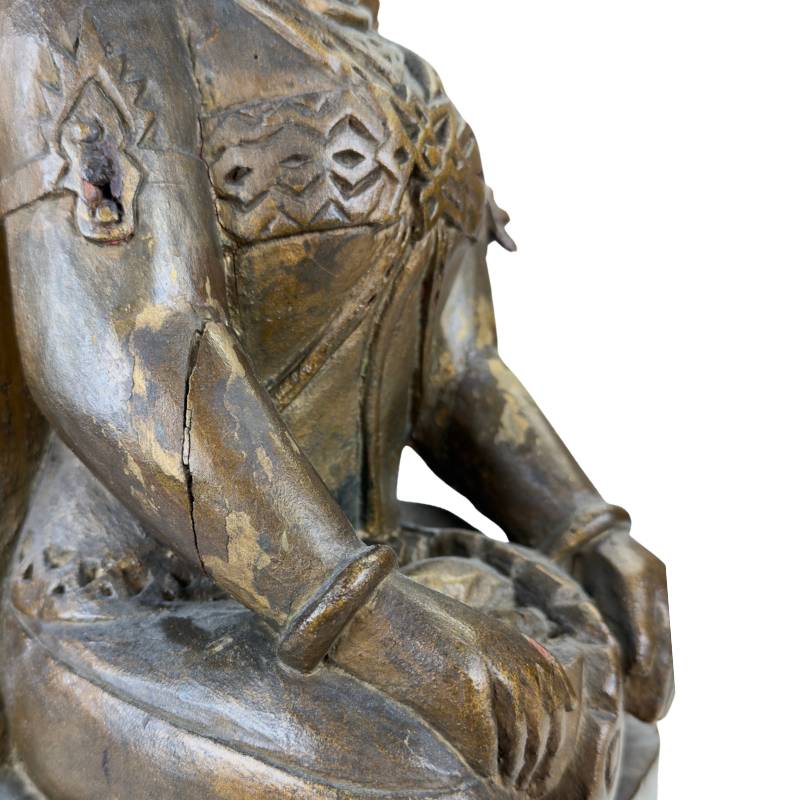Sri Devi wooden statue with subtle forward-bent posture detail