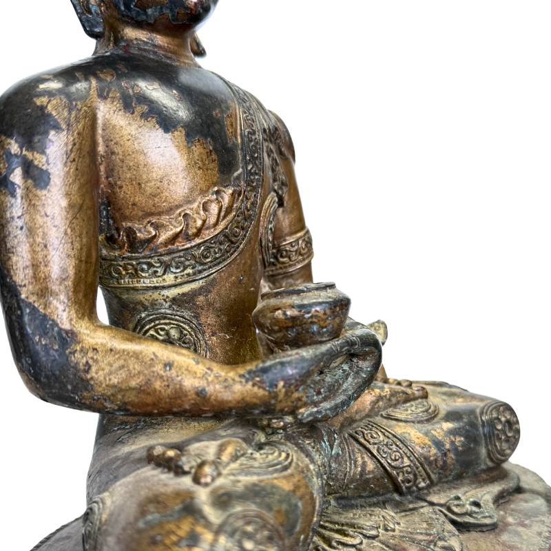 Tibetan altar statue of gilded bronze with patina