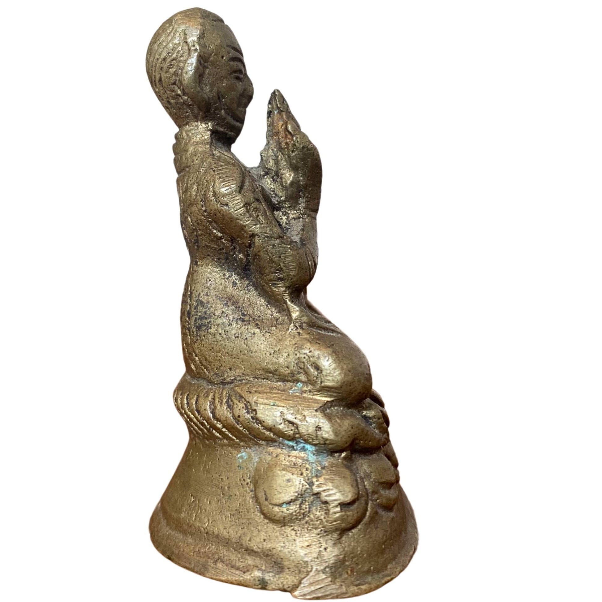 Side view shows green mineralization and natural patina in the folds of the robe.