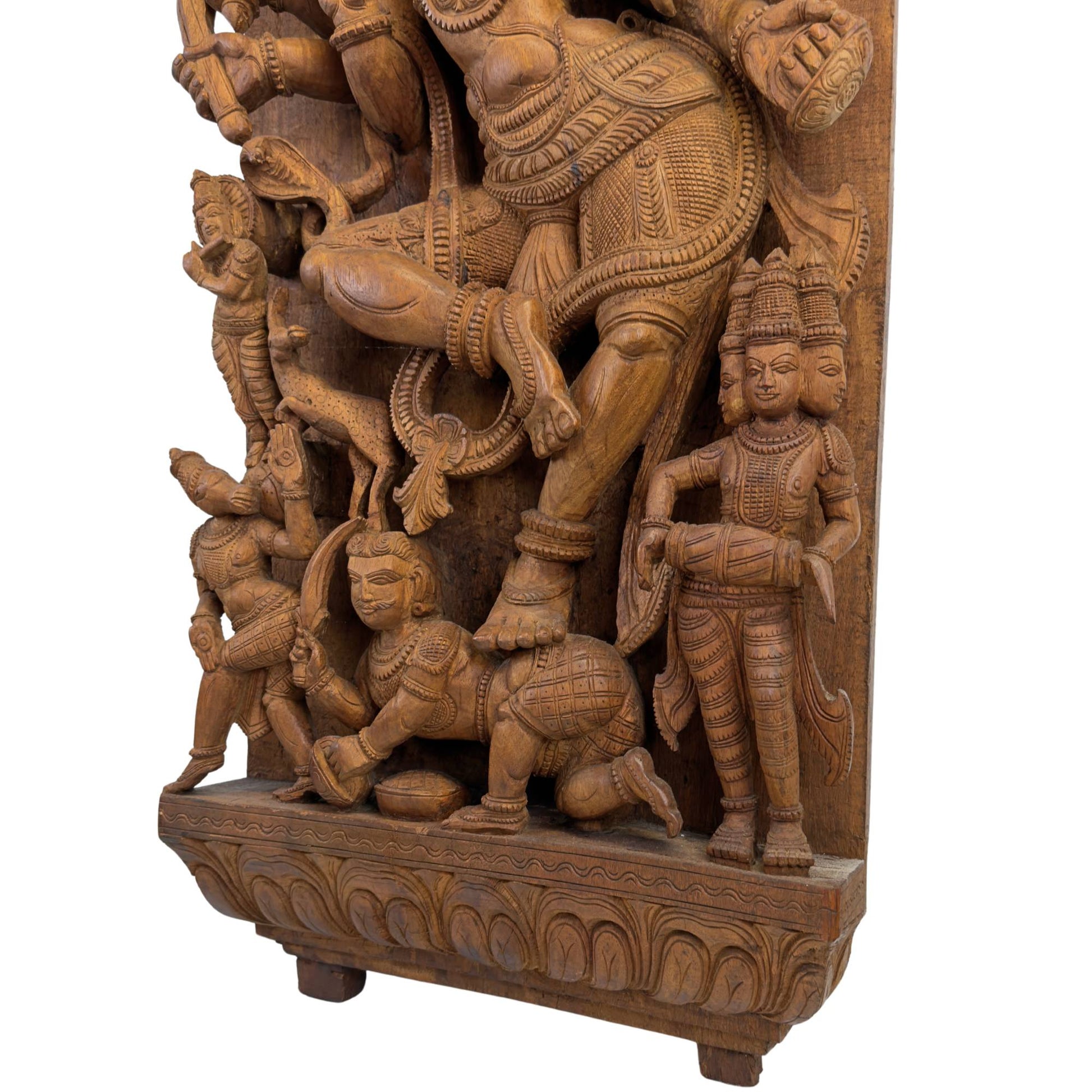 Side view of the wooden Ratha relief showing the depth of the alto-rilievo carving and the matte patina.