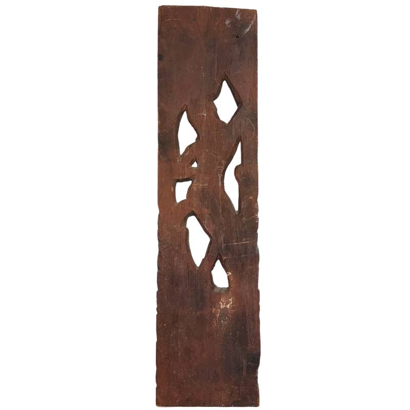 Back of an antique Balinese wood sculpture with historical oxidation and wood grain