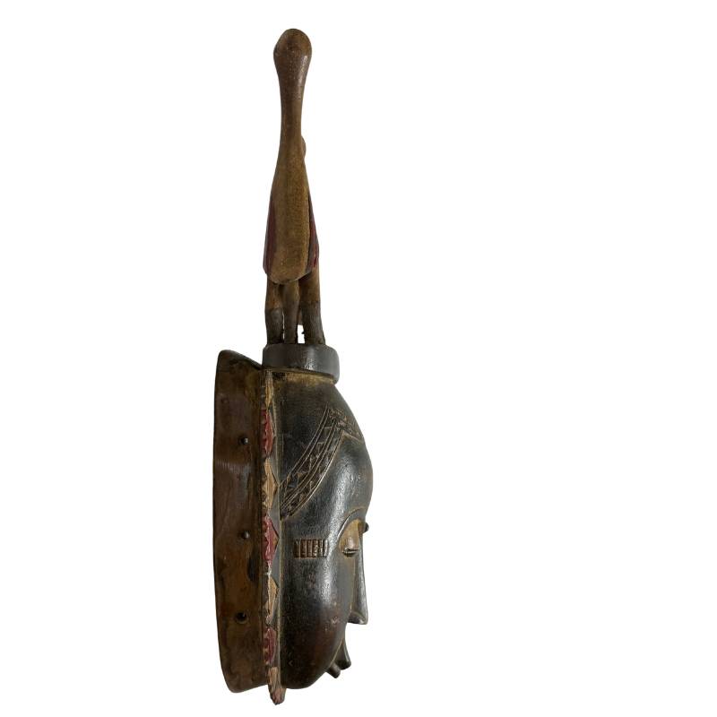 The hand-carved interior of the 51 cm high African Baule mask with verified oily wear patina and the original wooden bite block.