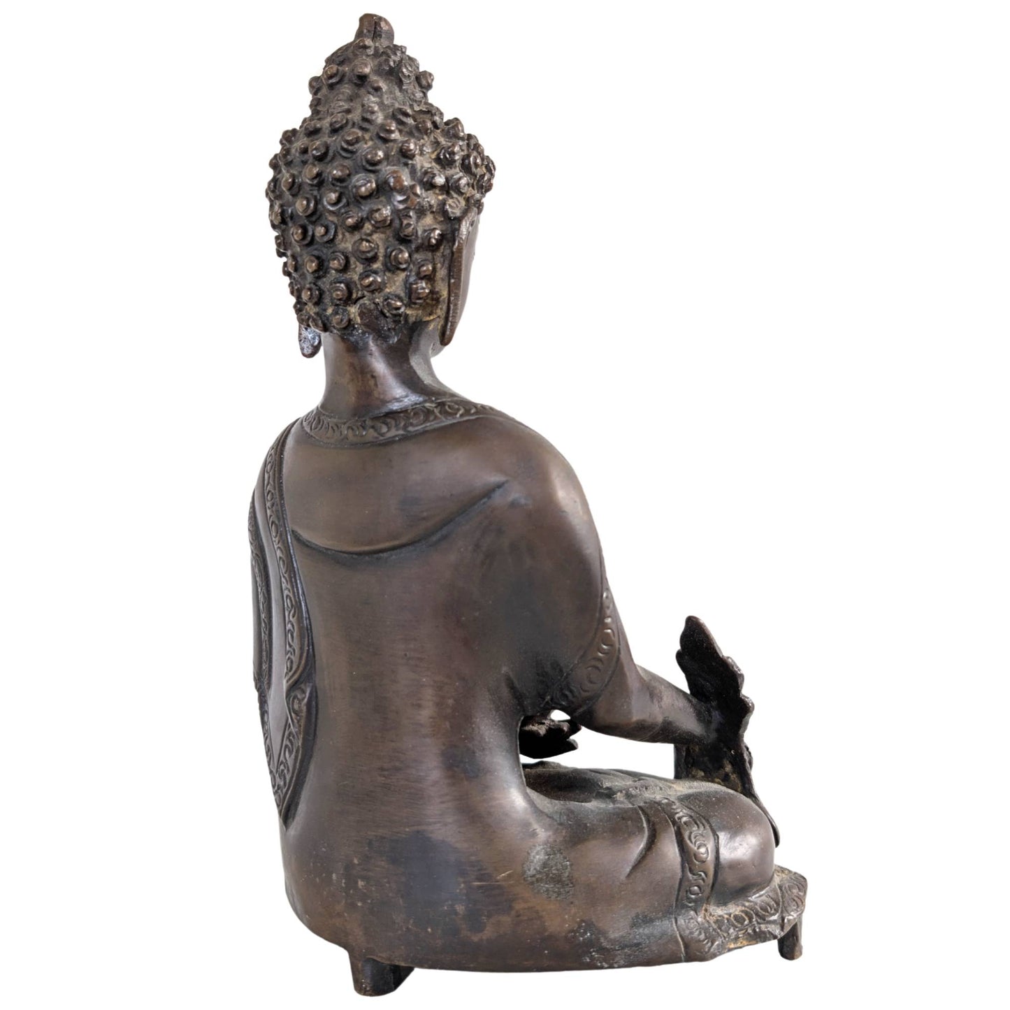 The back of the handmade bronze statue with visible casting marks.