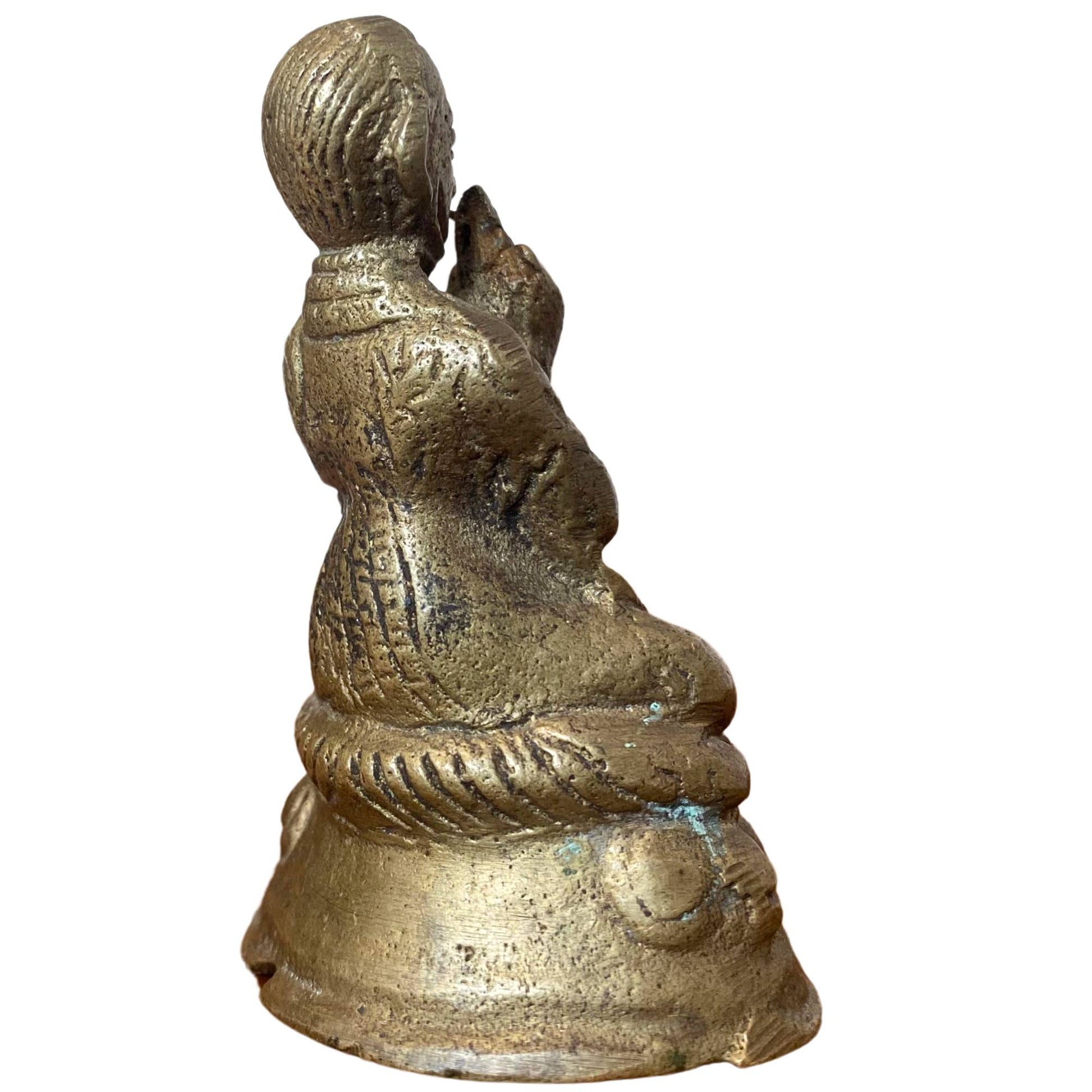 Back of the solid cast bronze figure with clear manual finish.