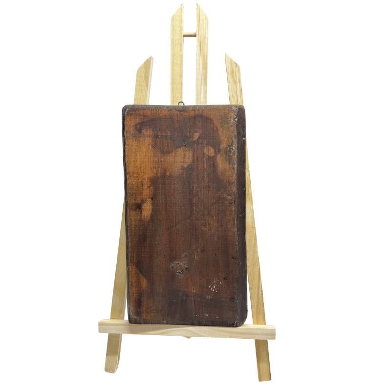 Back of the hand-carved wooden icon panel with traces of age and woodworm holes to confirm authenticity.