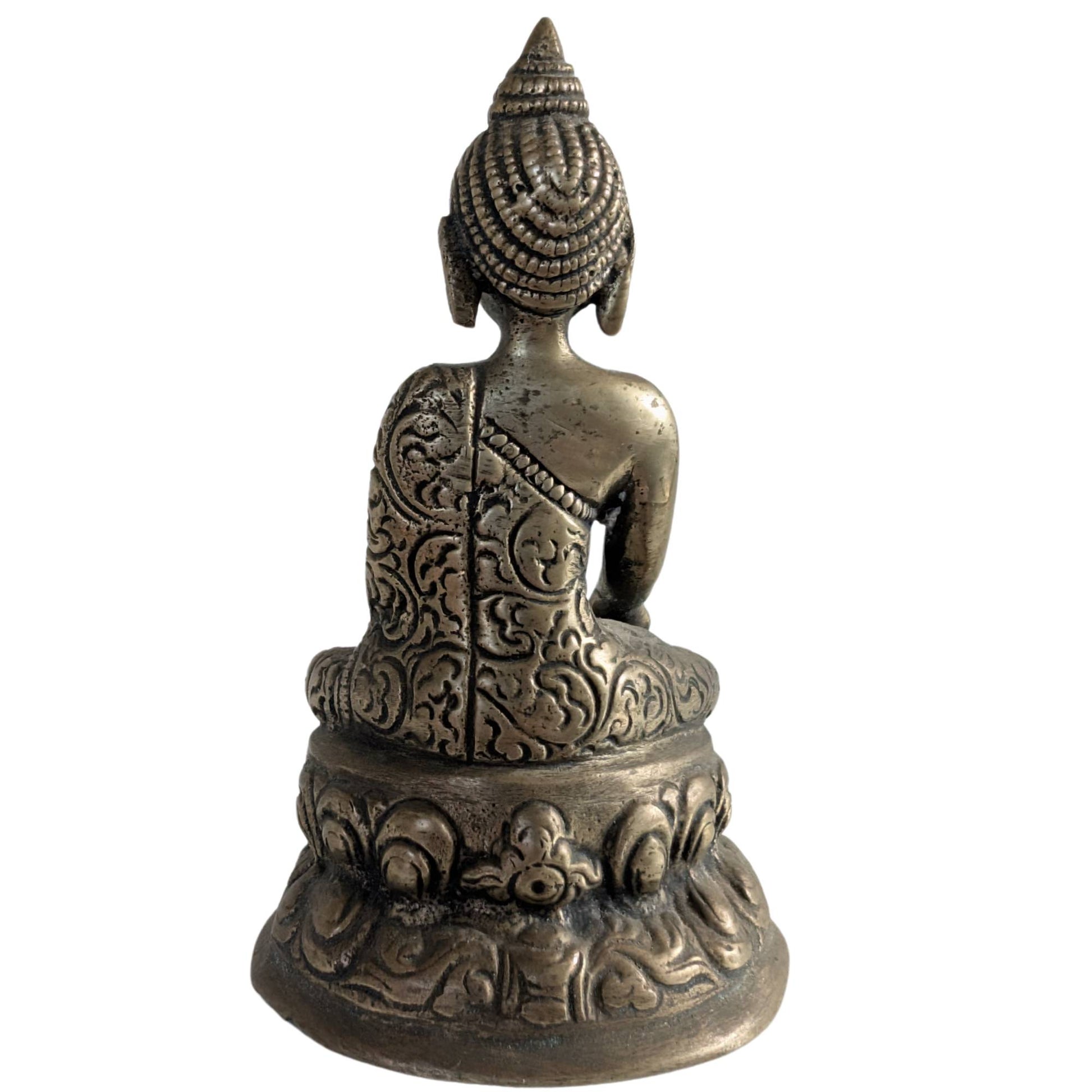 Back of the small brass Buddha figurine with engraved details.