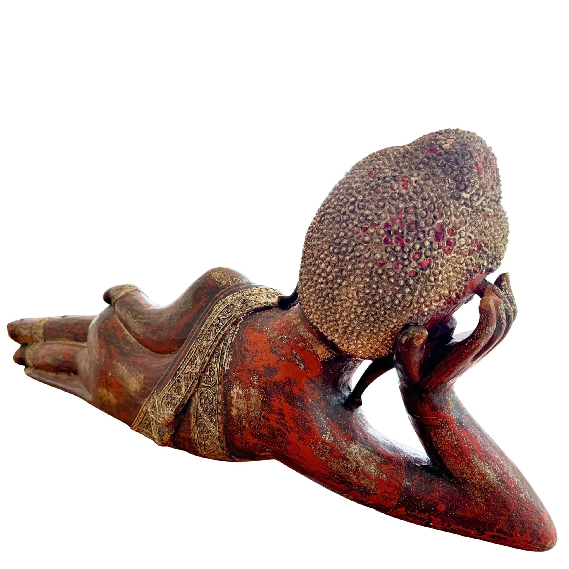 The back of the large wooden Buddha statue with authentic carving marks and red lacquer