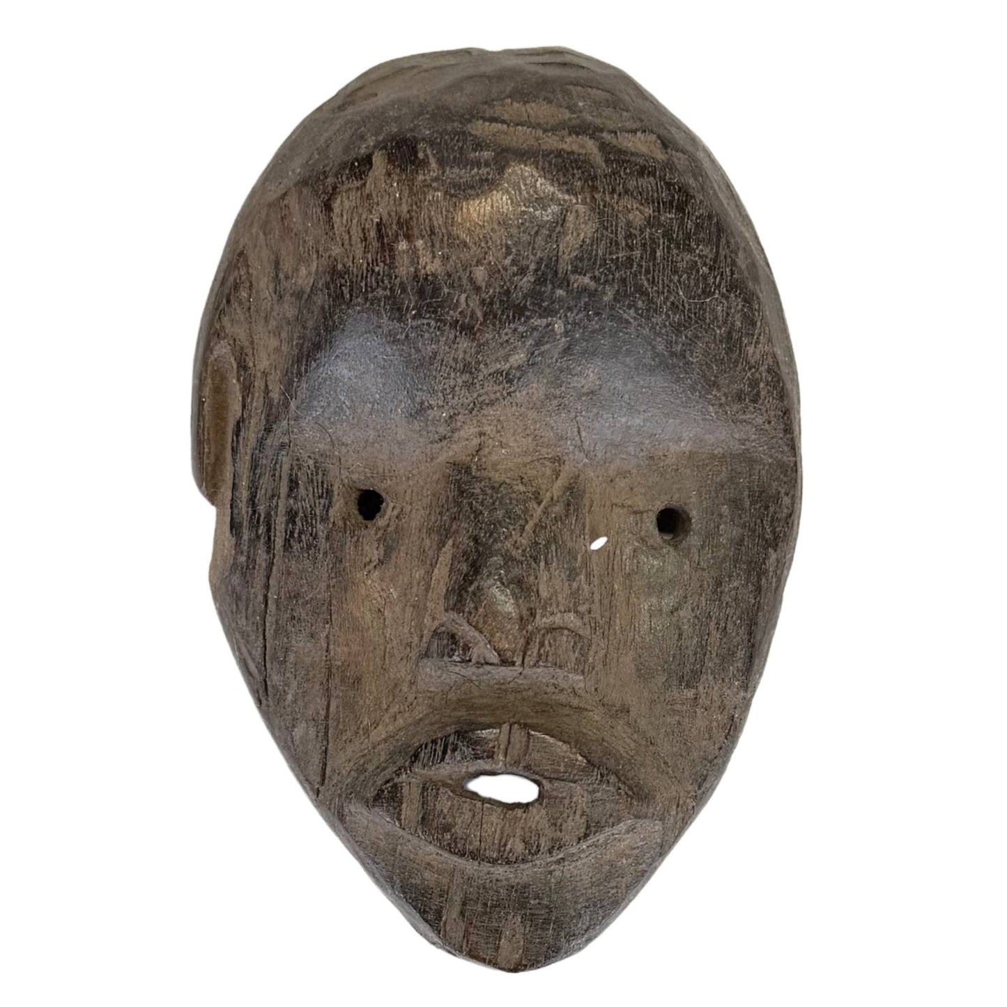 Old hand-carved African wooden mask with dark patina and tribal appearance