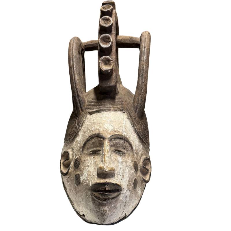African wooden ritual mask, hand-carved tribal object with white face layer and powerful ceremonial form