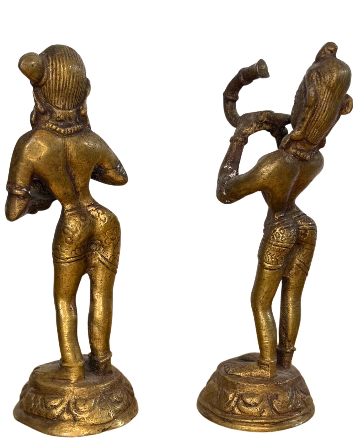 Hindu bronze altar statues pair used in a ritual setting