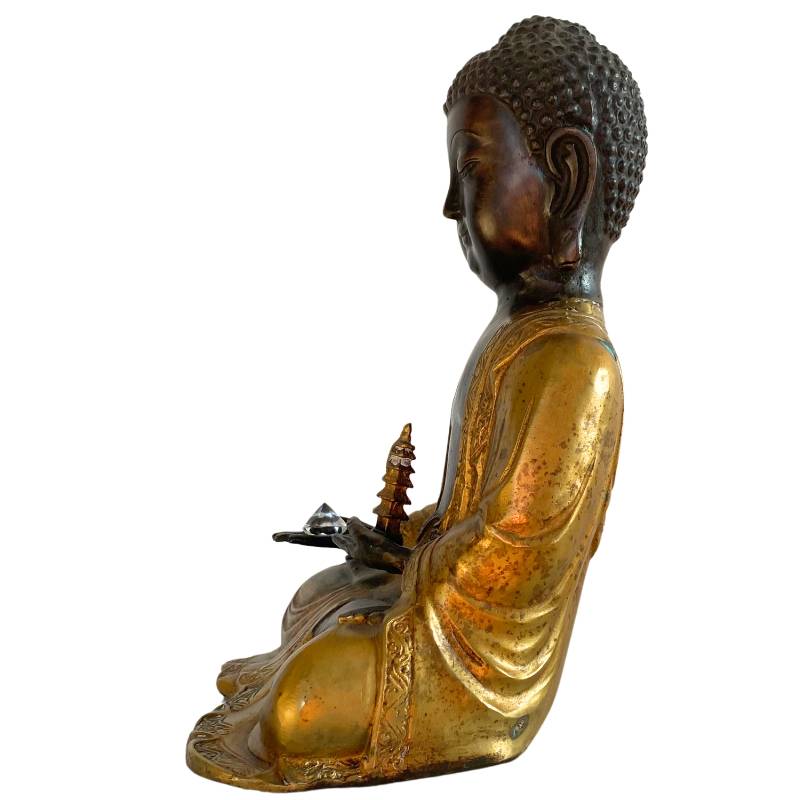 Amitabha bronze Buddha with crystal and ritual elements in meditation posture