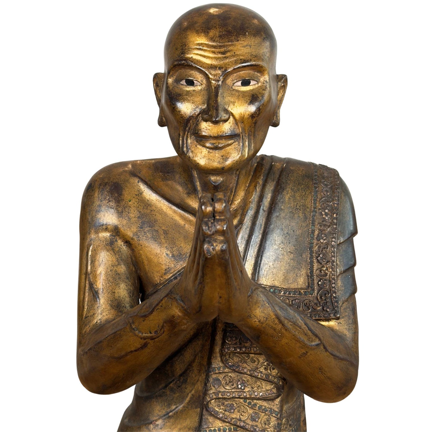 Burmese monk Moggallana of gilded wood with inlaid mirror glass eyes and hands in an anjali mudra praying posture.