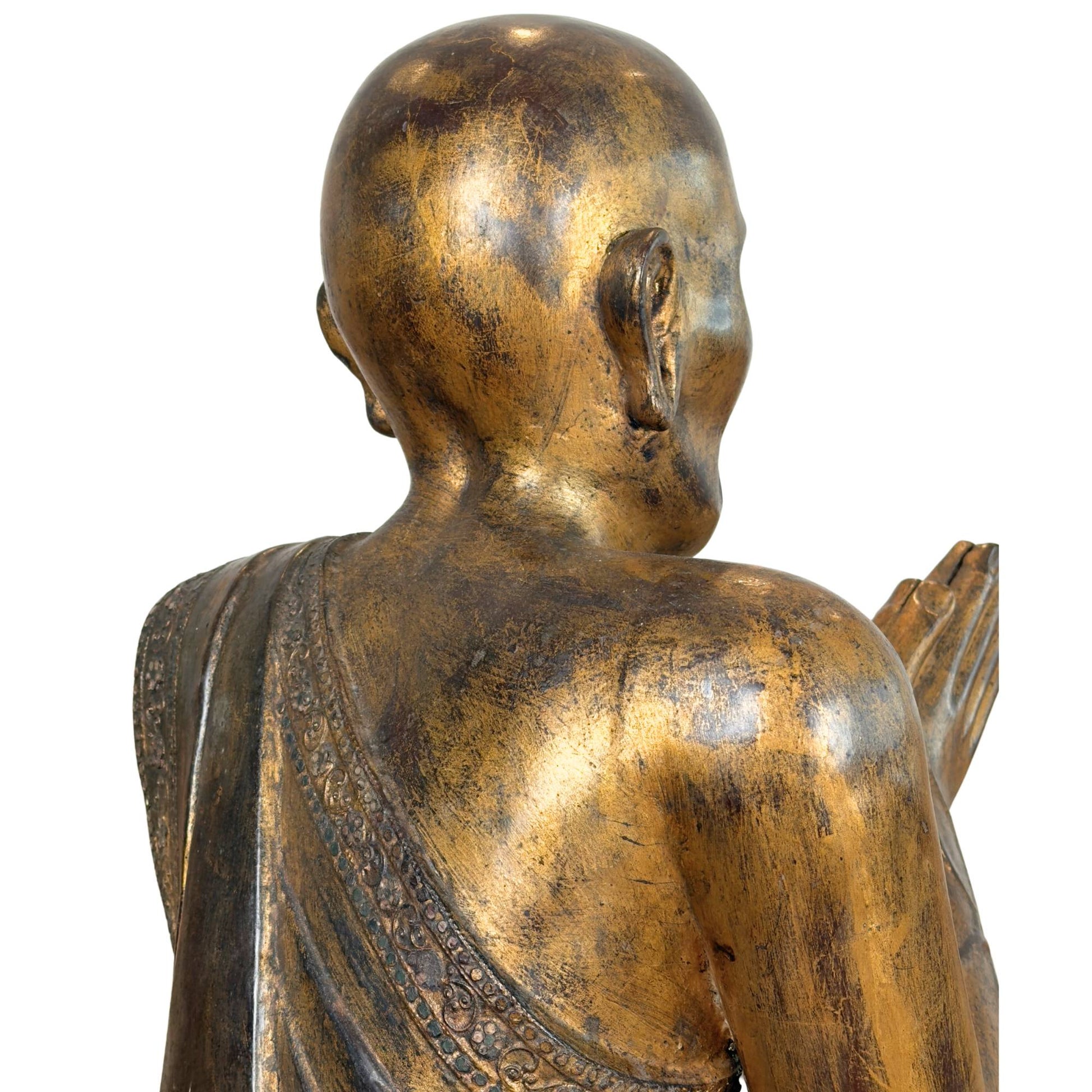 Skull side and right shoulder of the Burmese monk Sariputta with dark thit-si lacquer patina and worn gold leaf.