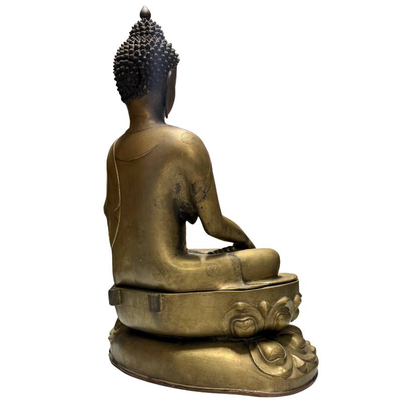 antique Himalayan Buddha statue made of bronze with remains of fire gilding