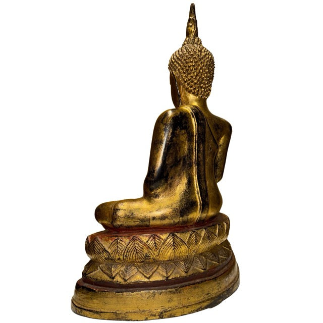 Antique Buddha statue with old gilding, red undercoat, and natural ritual wear