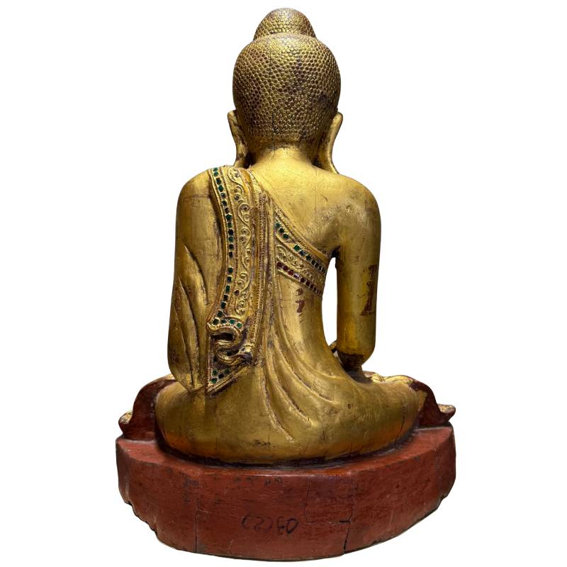Antique Buddha statue with red lacquer underlay, gilding, and natural devotional wear