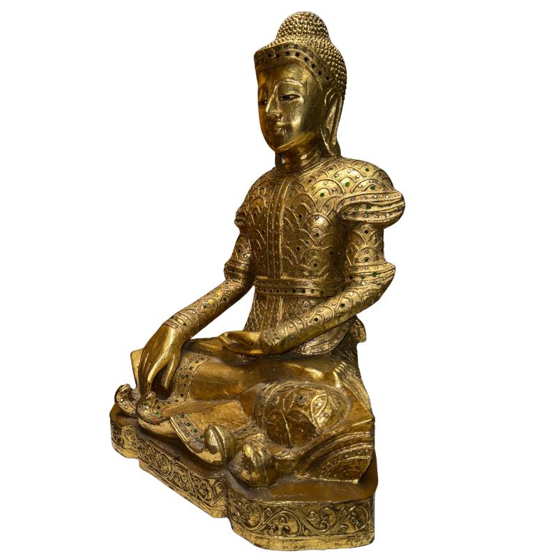 Antique Buddha statue from Myanmar with a gilded robe and classic earth-touching pose