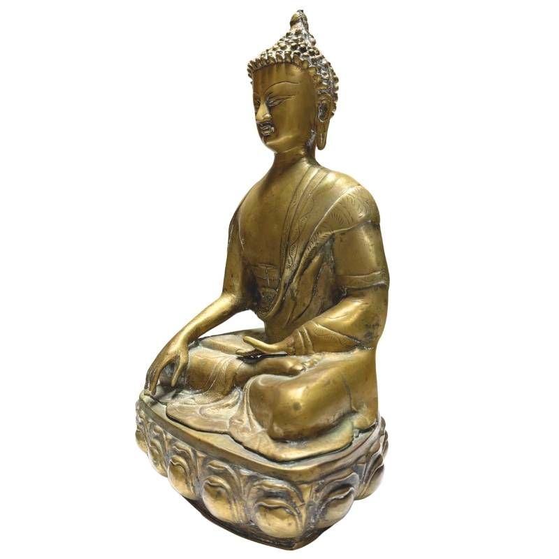 Antique Buddha statue with fire-gilded surface and lotus throne