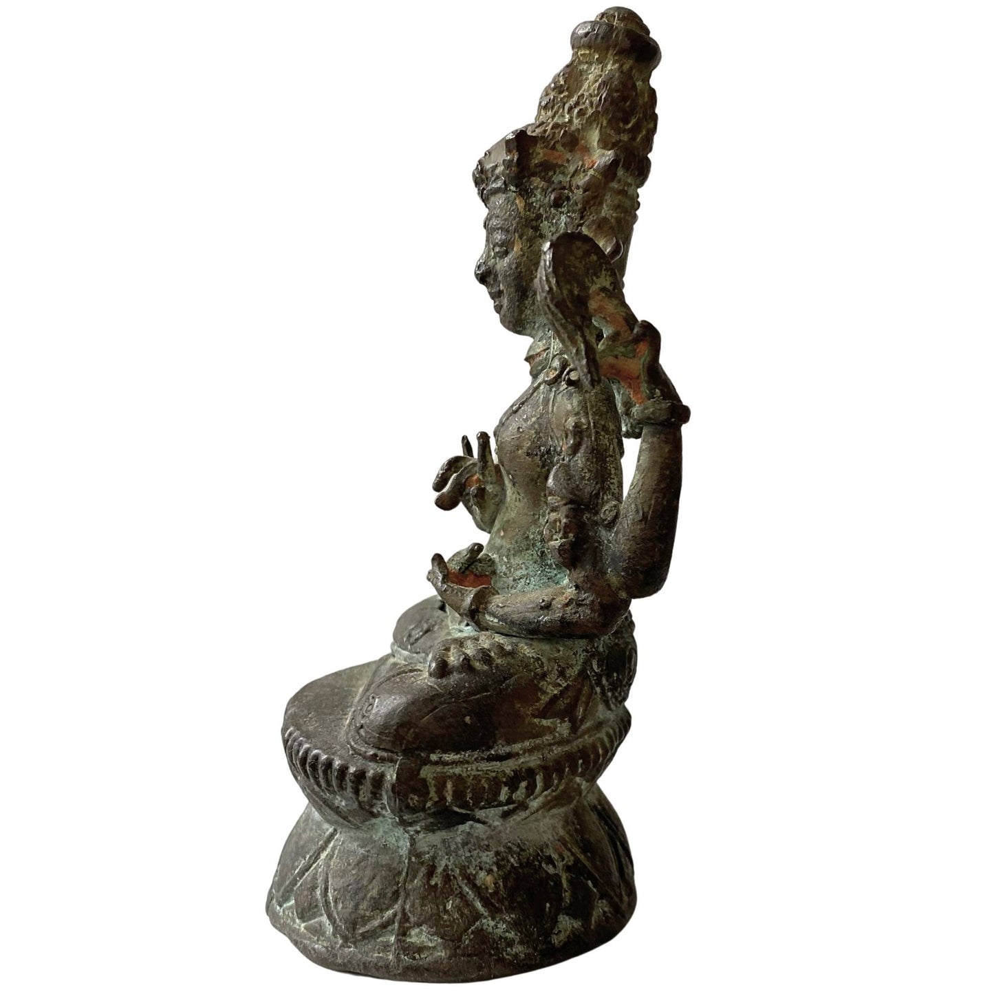 Detail of historical cuprite oxidation on antique Tibetan bronze Buddha statue
