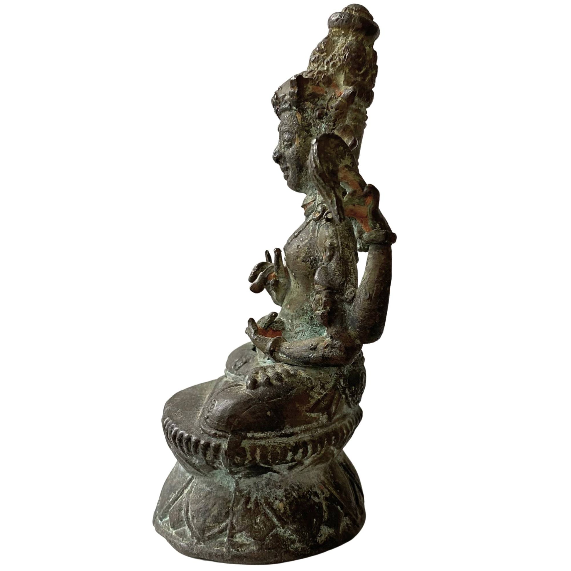 Detail of historical cuprite oxidation on antique Tibetan bronze Buddha statue