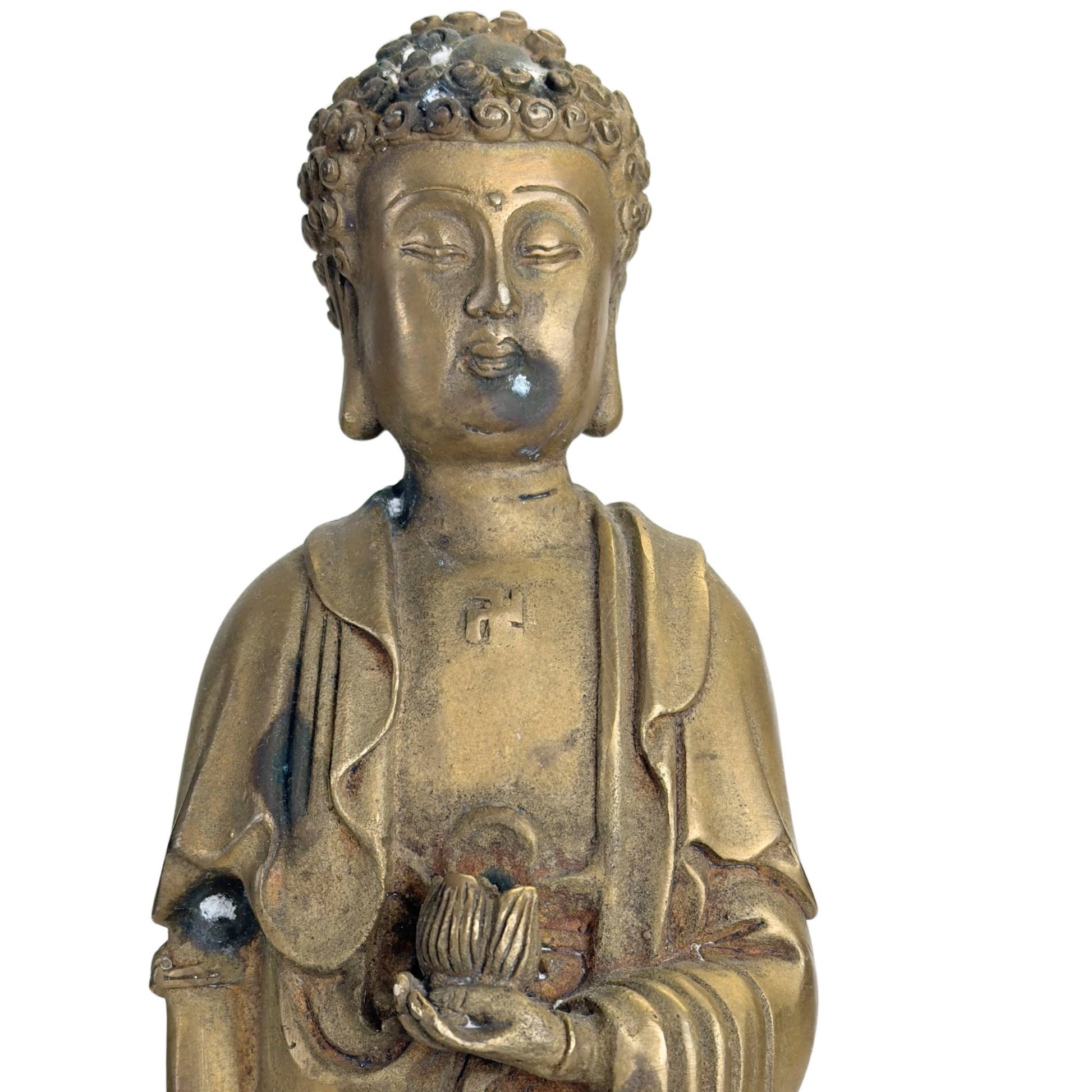 Antique bronze Buddha statue with old traces of oxidation, lotus base, and warm golden-brown patina