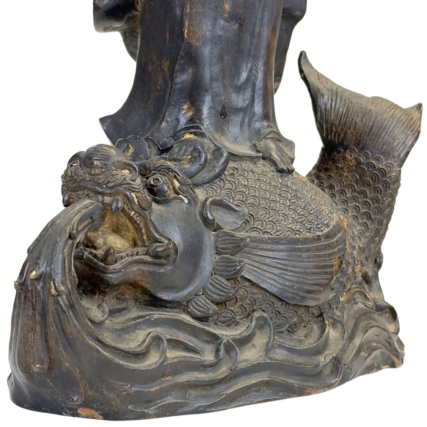 Antique bronze bodhisattva statue on a water dragon with richly detailed base and spiritual significance