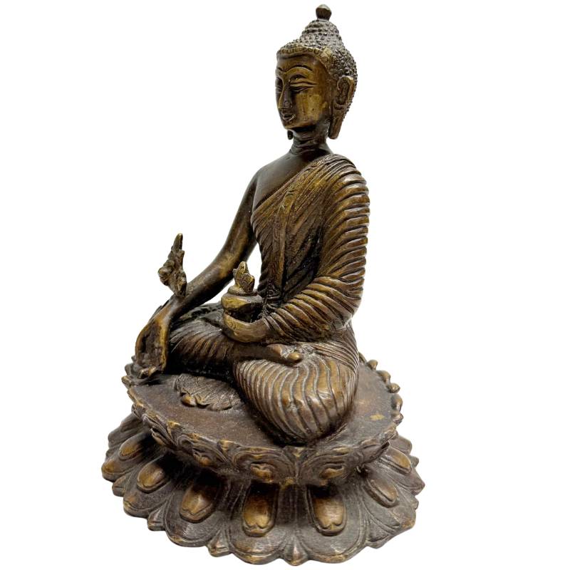 Antique bronze Buddha statue with a spiritual aura
