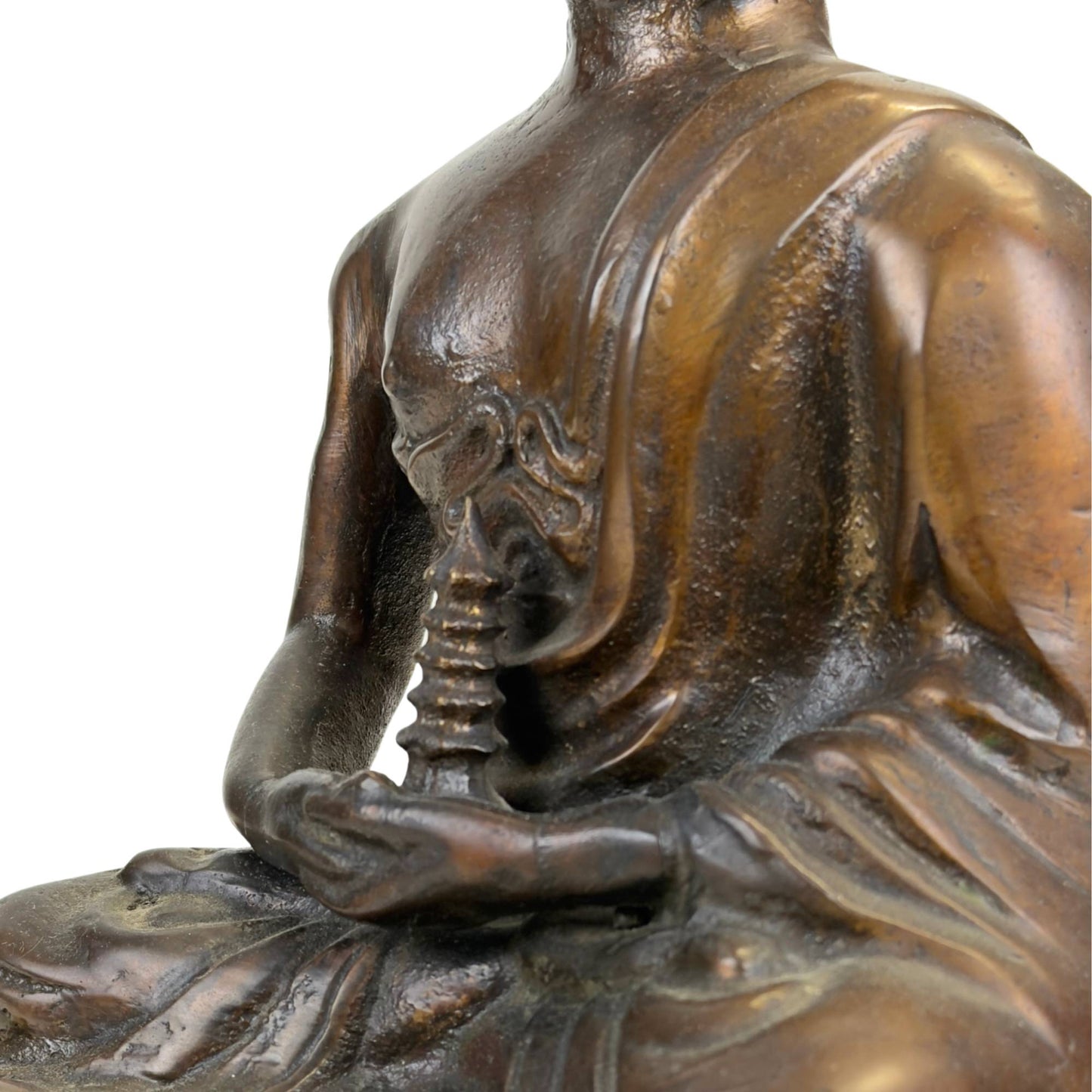 Antique bronze Buddha statue with visible internal markings, old oxidation, and heavy casting and stupa