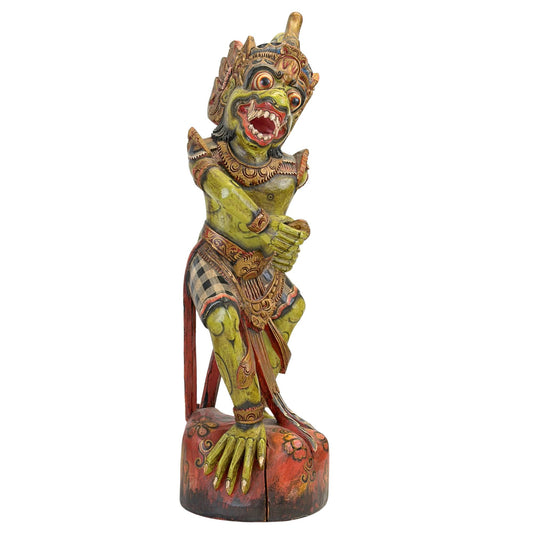 Porte-keris en bois fait main, orné des traits féroces du visage de Dwarapala et de véritables fragments de feuilles d'or Prada.