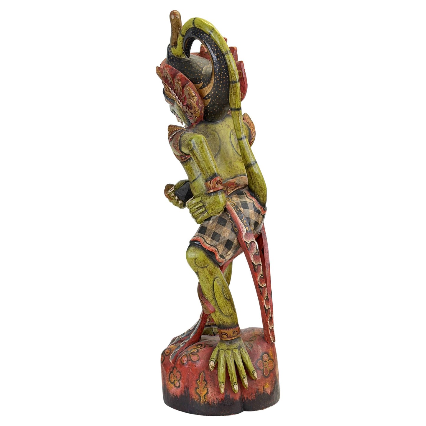 Vue latérale du porteur de kris en bois d'Hanuman, avec ses défenses verticales caractéristiques et ses ailes de couronne royale.