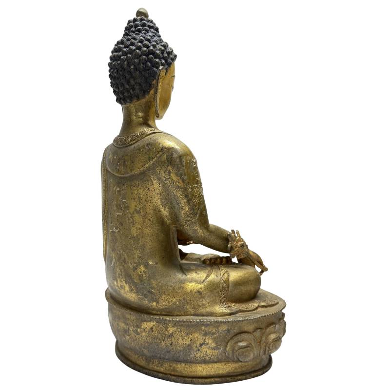 Antique bronze statue of the Physician Buddha with healing vessel