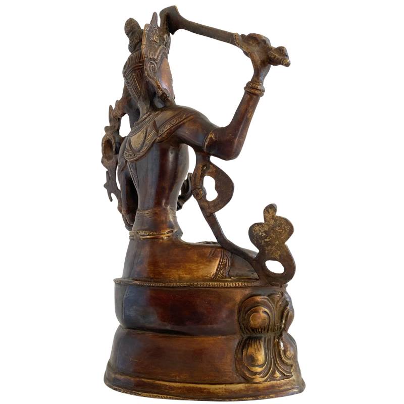 Antique Himalayan Manjushri statue with a spiritual aura