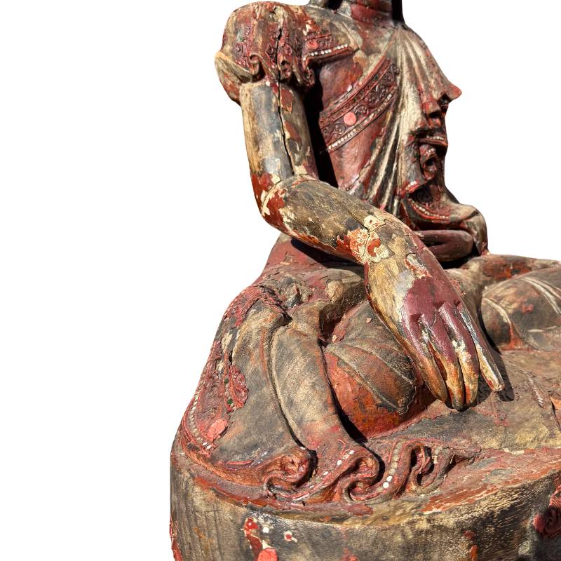 Antique wooden Buddha statue from Burmese temple tradition
