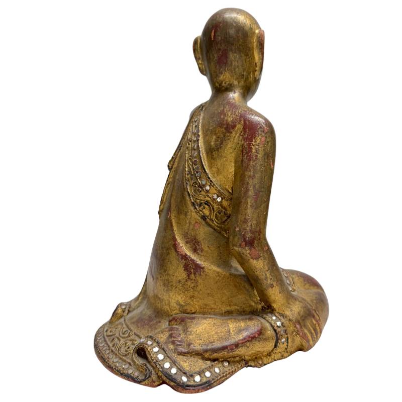 Rear view of the wooden statue with visible patina and wood carving.