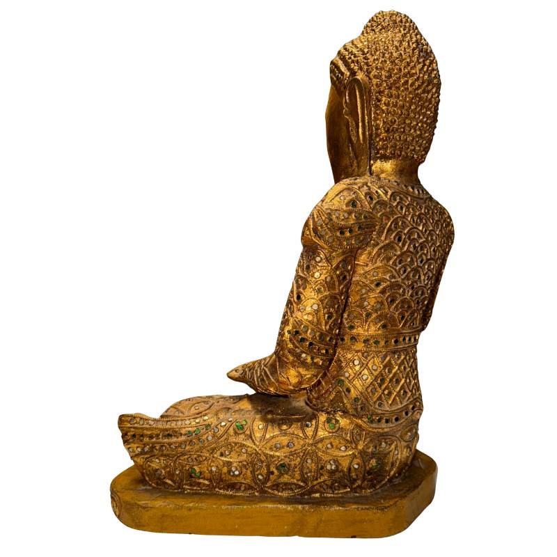 Antique Myanmar Buddha statue with richly decorated gilded robe and spiritual aura