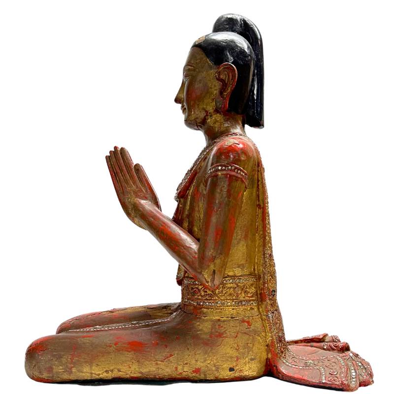 Antique Myanmar monk statue with lacquer aging
