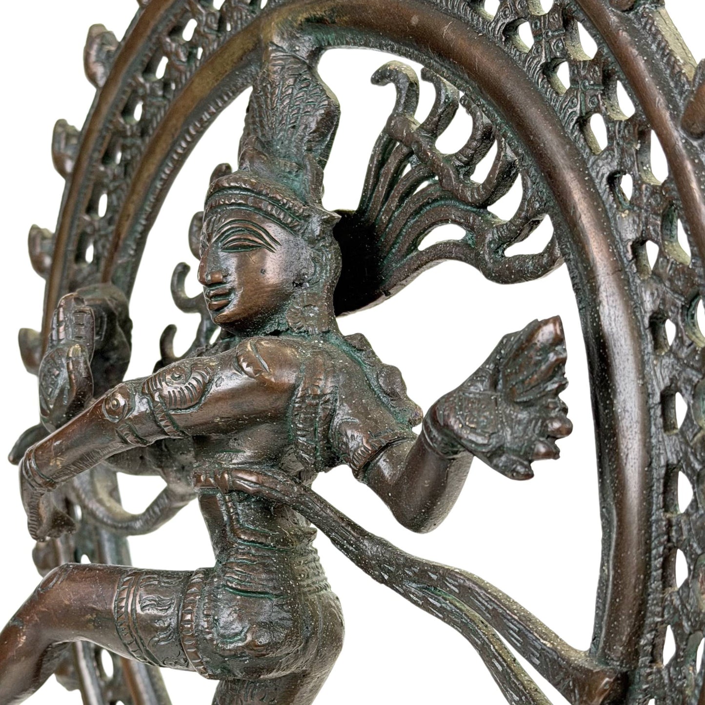 Antique Nataraja statue with dancing Shiva, richly decorated halo and deep green oxidation